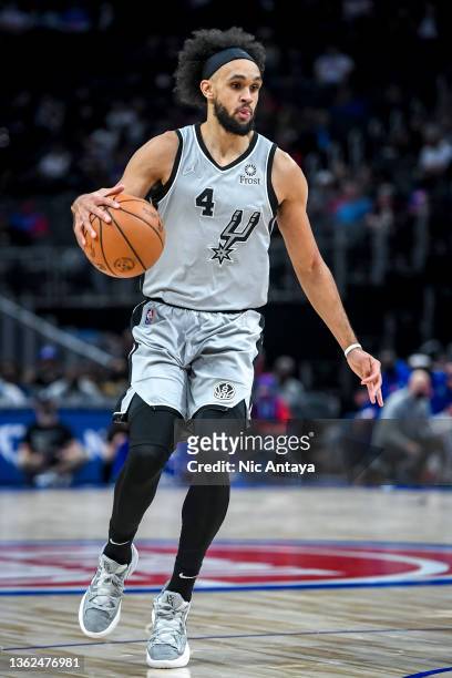 Derrick White of the San Antonio Spurs handles the ball against the Detroit Pistons at Little Caesars Arena on January 01, 2022 in Detroit, Michigan....