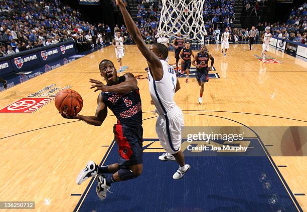 Anthony Myers of the Robert Morris Colonials shoots a layup past Joe Jackson of the Memphis Tigers on December 29, 2011 at FedExForum in Memphis,...