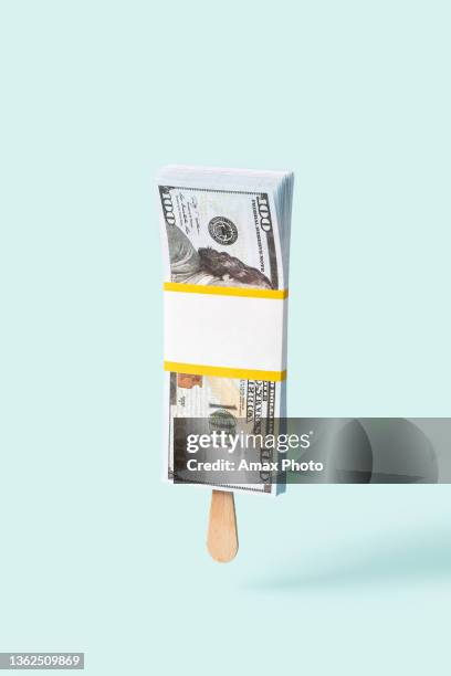 concept of ice-cream with money. dollars banknotes on light background - realismo conceptual imagens e fotografias de stock