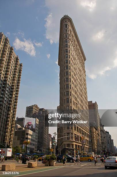 looking upward at trapezoidal city building. - flatiron district stock pictures, royalty-free photos & images