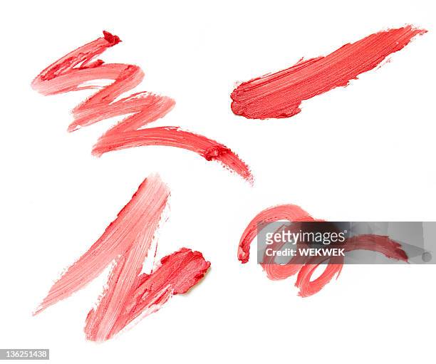 set of four red lipstick smears on white background - smudged stockfoto's en -beelden