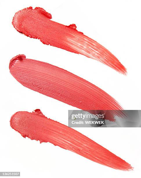 three smears of red lipstick on a white background - smudged stock pictures, royalty-free photos & images