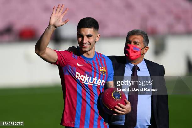 Ferran Torres and FC Barcelona president Joan Laporta acknowledge the fans as he is presented as a FC Barcelona player at Camp Nou on January 03,...