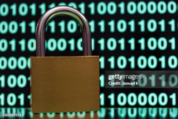 close up view of padlock against blurred binary codes - safety concept , internet security concept - loose change private view stock pictures, royalty-free photos & images