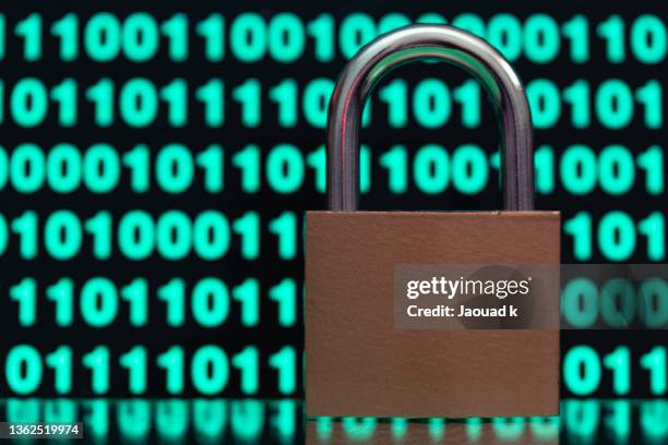 close up view of padlock against blurred binary codes - safety concept , internet security concept - loose change private view stock pictures, royalty-free photos & images