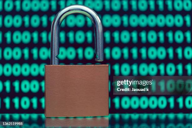 close up view of padlock against blurred binary codes - safety concept , internet security concept - loose change private view stock pictures, royalty-free photos & images