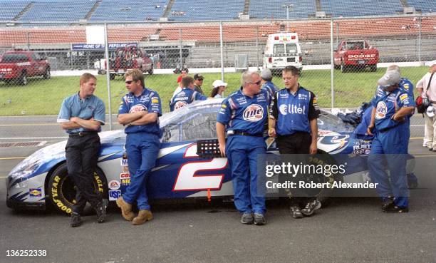 Members of NASCAR driver Rusty Wallace's Miller Lite racing crew wait their turn to enter the NASCAR inspection station prior to the 2005 Pepsi 400...