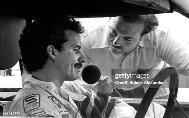 Driver Kyle Petty is interviewed by race broadcaster Dr. Jerry Punch prior to the start of the 1981 Firecracker 400 on July 4, 1981 at the Daytona...