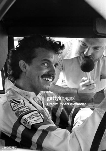 Driver Kyle Petty is interviewed by race broadcaster Dr. Jerry Punch prior to the start of the 1981 Firecracker 400 on July 4, 1981 at the Daytona...