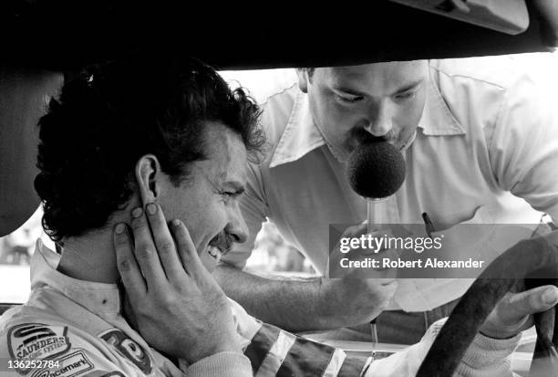 Driver Kyle Petty is interviewed by race broadcaster Dr. Jerry Punch prior to the start of the 1981 Firecracker 400 on July 4, 1981 at the Daytona...