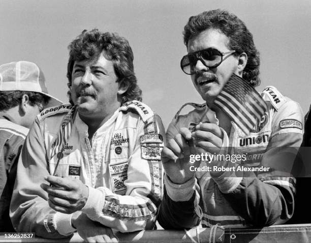 Drivers Kyle Petty, right, and Tim Richmond wait for their names to be called at drivers' introductions during opening ceremonies for the 1984...