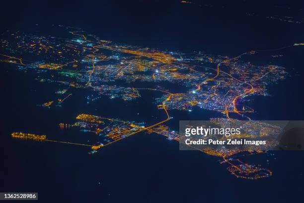 manama, capital city of bahrain, aerial view in the night - bahrain stock pictures, royalty-free photos & images