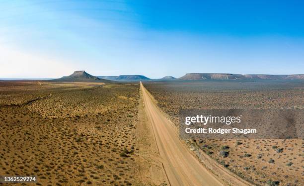 aerial view of a rural road leading to “nowhere” ... - karoo stock pictures, royalty-free photos & images