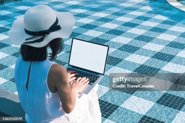 Using Laptop Poolside Photos and Premium High Res Pictures - Getty Images