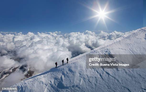 climbers on a snowy ridge - imperial system fotografías e imágenes de stock