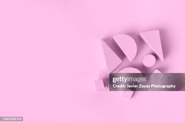 pink wooden toy blocks on pink - building block isolated stock pictures, royalty-free photos & images