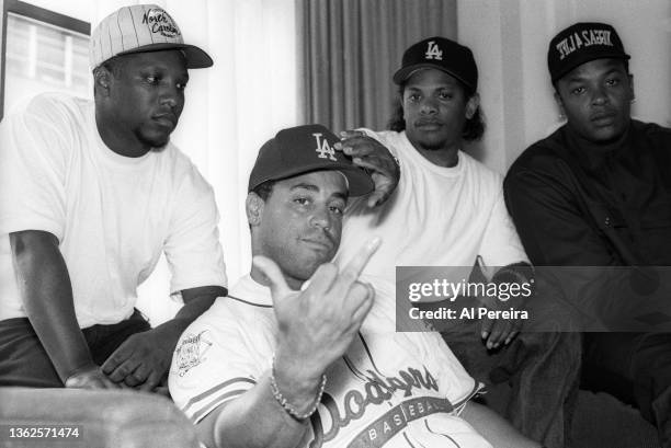 Rap group N.W.A. Appears in portrait and DJ Yella flashes a middle finger obscene gesture as their new CD, "Elif4ZaggiN" reaches number one on the...