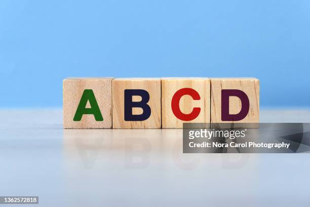 a b c d alphabets on wood blocks - lettera a c foto e immagini stock