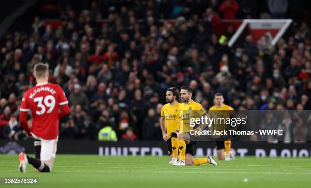 Joao Moutinho of Wolverhampton Wanderers takes a takes a knee in support of the fight against racism prior to the Premier League match between...