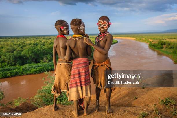 young boys from karo tribe, ethiopia, africa - boy river looking at camera stock pictures, royalty-free photos & images