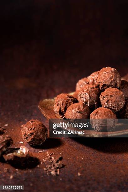 chocolate truffles on a brown background stock photo - chocolate truffle stock pictures, royalty-free photos & images