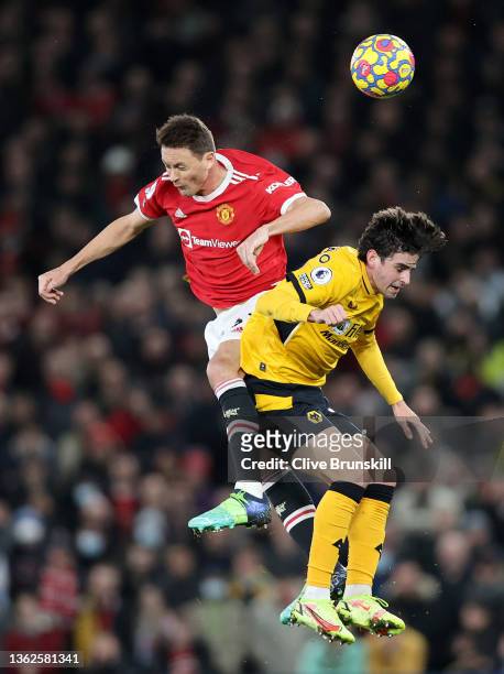 Nemanja Matic of Manchester United and Francisco Trincao of Wolverhampton Wanderers contest a header during the Premier League match between...