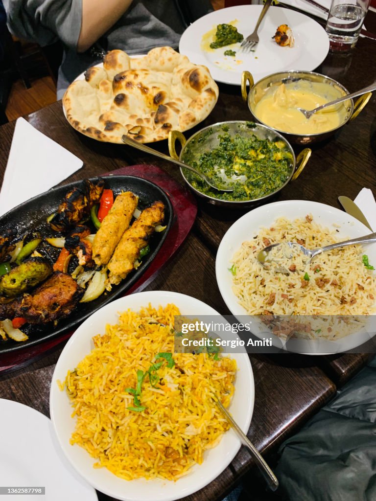 Indian tandoori mixed platter, lamb biryani, malai chicken korma, Saad paneer and garlic naan bread