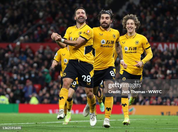 Joao Moutinho of Wolverhampton Wanderers celebrates after scoring their side's first goal during the Premier League match between Manchester United...