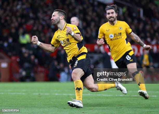 Joao Moutinho of Wolverhampton Wanderers celebrates with teammate Ruben Neves after scoring their side's first goal during the Premier League match...