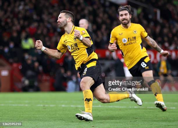Joao Moutinho of Wolverhampton Wanderers celebrates with teammate Ruben Neves after scoring their side's first goal during the Premier League match...