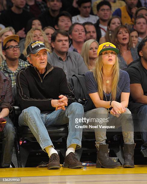 Kaley Cuoco and her father Gary Cuoco attend the Los Angeles Lakers vs New York Knicks game on December 29, 2011 in Los Angeles, California.