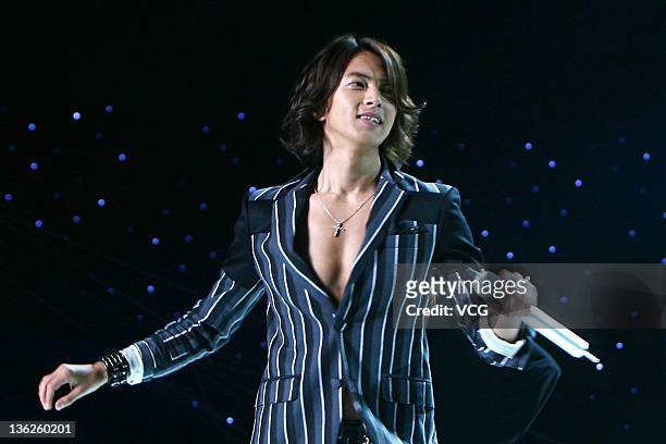 Japanese singer and actor Yamashita Tomohisa performs on the stage while recording the New Year Gala of Dragon TV on December 29, 2011 in Shanghai,...