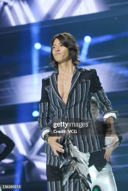 Japanese singer and actor Yamashita Tomohisa performs on the stage while recording the New Year Gala of Dragon TV on December 29, 2011 in Shanghai,...