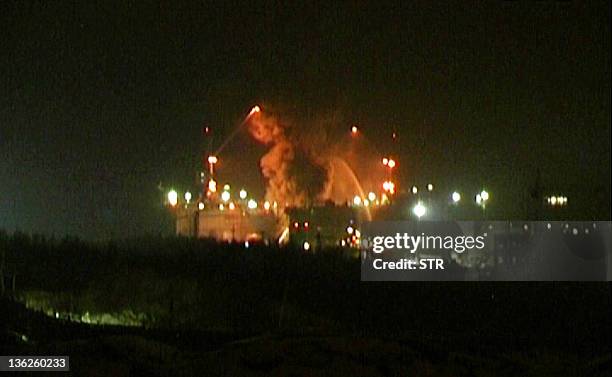 Grab from images released by Russia Today shows fire crew trying to extinguish a fire on board the Russian nuclear submarine Yekaterinburg docked in...