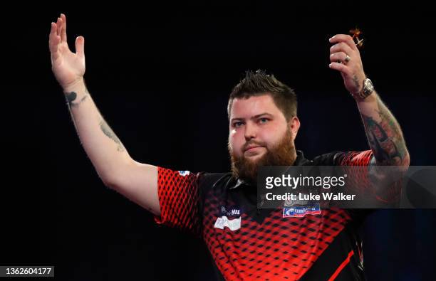 Michael Smith of England reacts during the Finals against Peter Wright of Scotland during Day Sixteen of The William Hill World Darts Championship at...