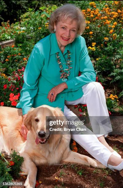 Actress Betty White, with her golden retriever Kitta is photographed for Los Angeles Times on June 25, 1999 in Brentwood, California. PUBLISHED...