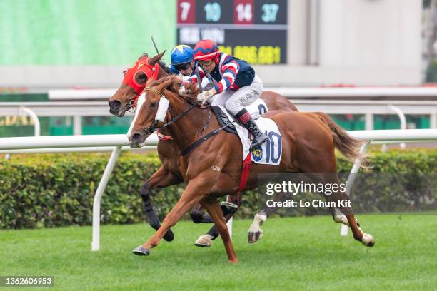 January 1 : Jockey Dylan Mo Hin-tung riding Mister Monte wins the Race 1 Yew Handicap at Sha Tin Racecourse on January 1, 2022 in Hong Kong.