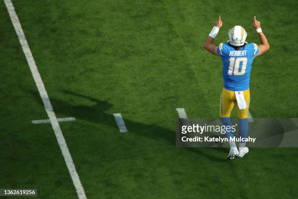 Justin Herbert of the Los Angeles Chargers looks on during the first quarter against the Denver Broncos at SoFi Stadium on January 02, 2022 in...