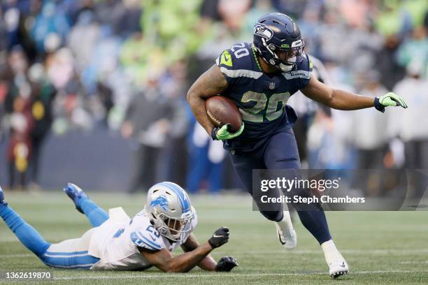 Rashaad Penny of the Seattle Seahawks carries the ball against the Detroit Lions during the third quarter at Lumen Field on January 02, 2022 in...