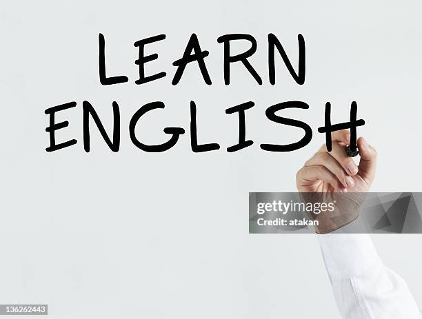 writing "learn english" - english culture stockfoto's en -beelden