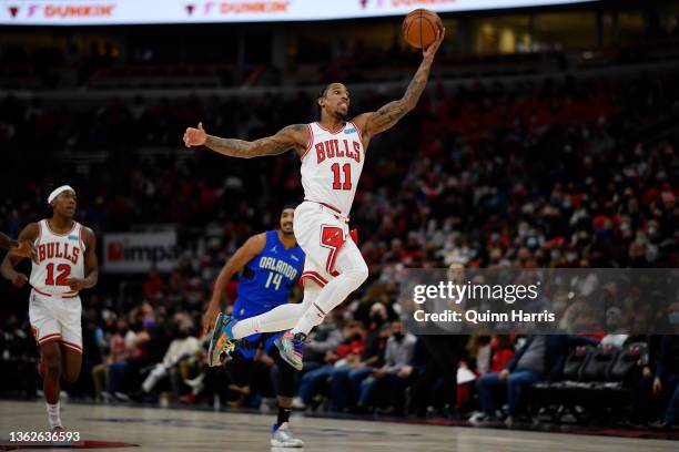 DeMar DeRozan of the Chicago Bulls leaps to catch a pass in the first half against the Orlando Magic at United Center on January 03, 2022 in Chicago,...