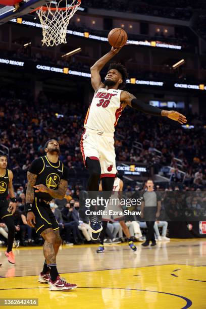 Chris Silva of the Miami Heat goes up for a dunk on Gary Payton II of the Golden State Warriors at Chase Center on January 03, 2022 in San Francisco,...