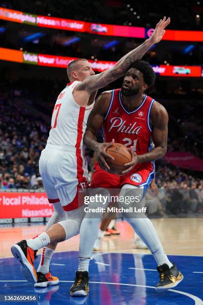 Joel Embiid of the Philadelphia 76ers controls the ball against Daniel Theis of the Houston Rockets at the Wells Fargo Center on January 3, 2022 in...