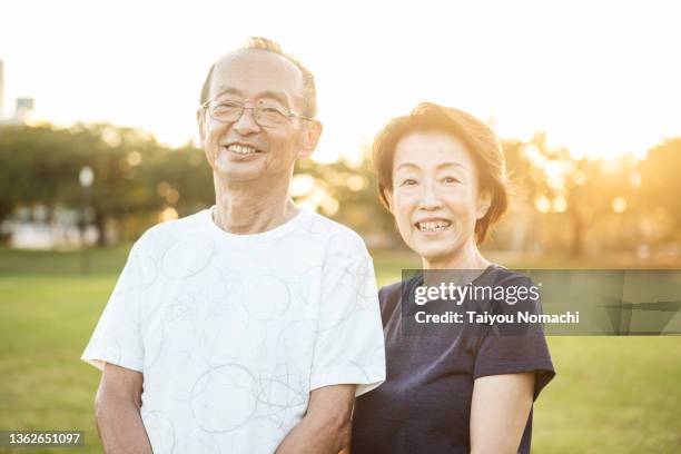 portrait of an active senior couple enjoying jogging - 夫婦 ストックフォトと画像