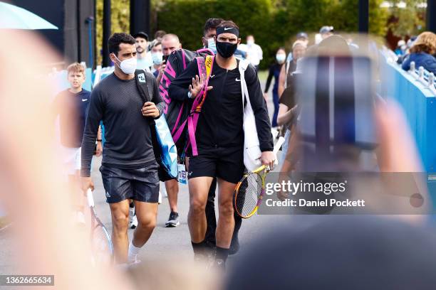 Rafael Nadal of Spain arrives with Jaume Munar of Spain for their doubles match aagainst Sebastian Baez and Tomas MartinEtcheverry of Argentina...
