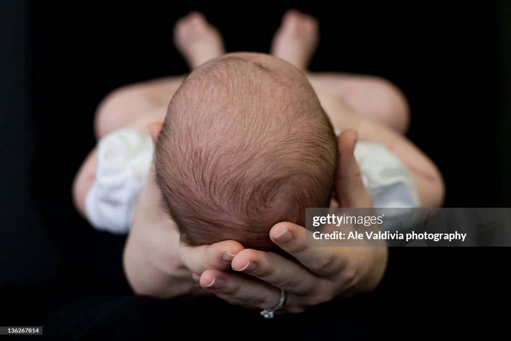 Woman holding baby girl