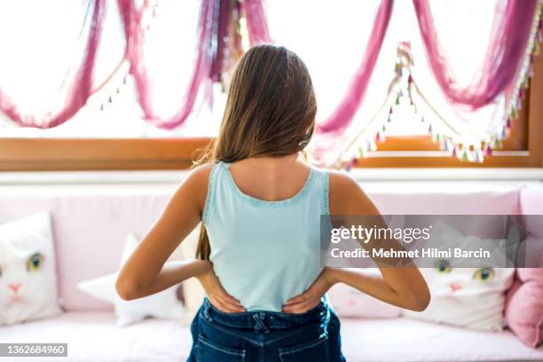 little girls with backache, pain in the human body - heup stockfoto's en -beelden