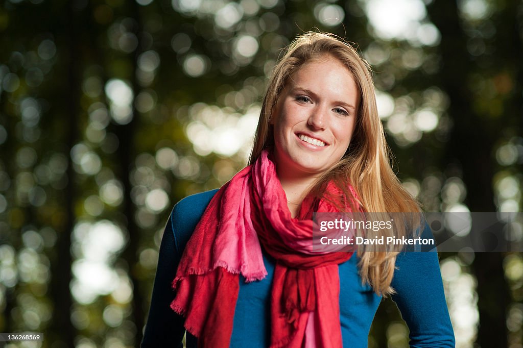 Smiling teenage girl wearing red scar