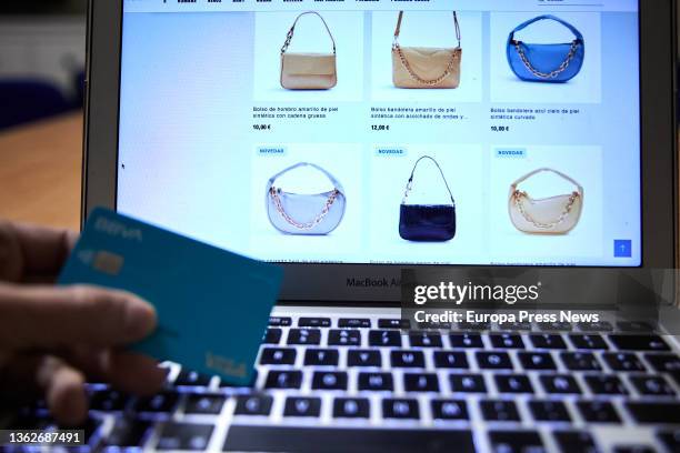 Person shops with his credit card during the week in which the online sales began, on January 4 in Madrid, Spain. The January and February sales...