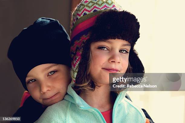 brother and sister twins in winter hats - twin girls stock pictures, royalty-free photos & images